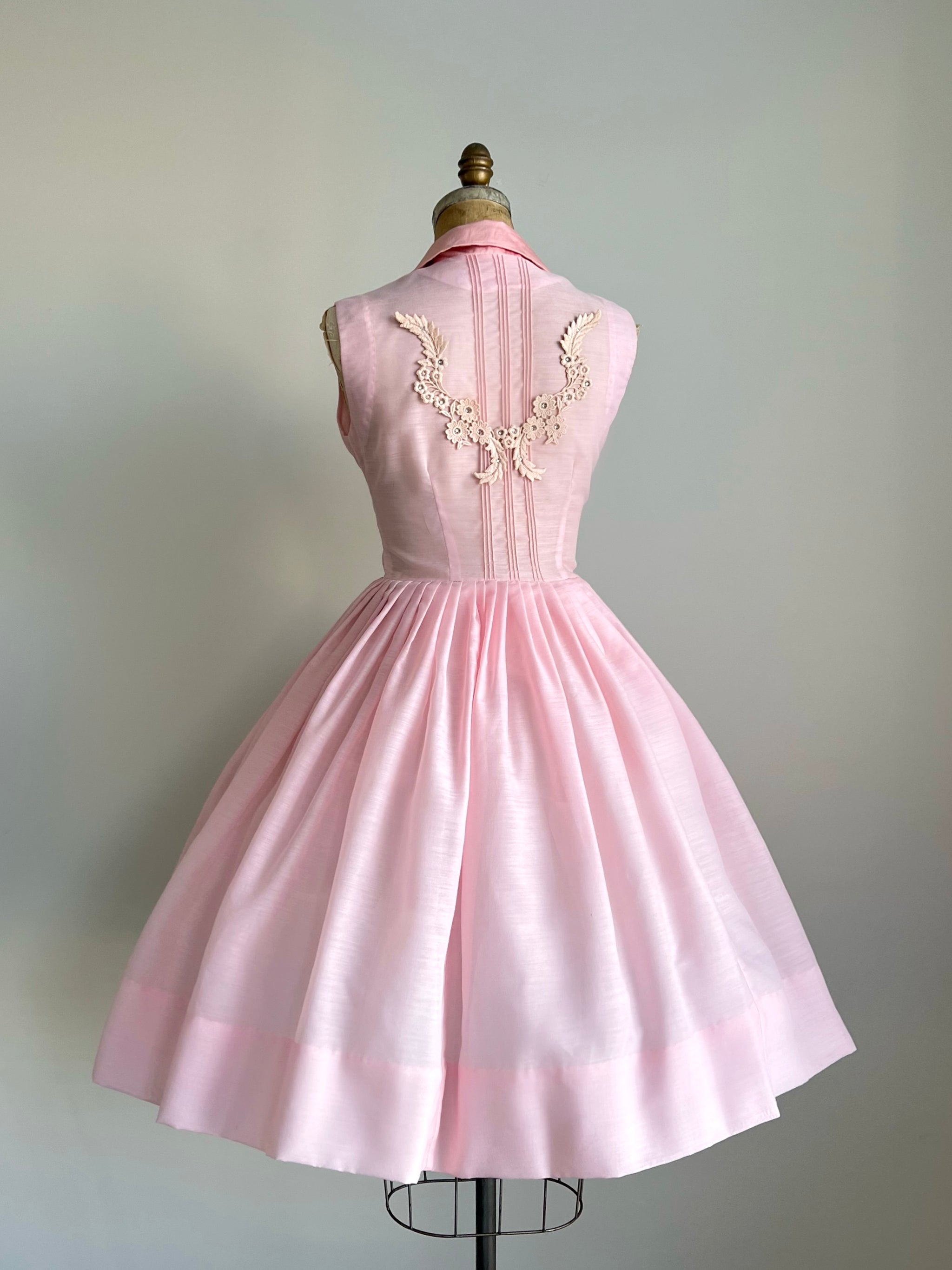 50s pink dress soldOh my heart this 1950s pink party dress is so incredibly beautiful!!! This is what mid-century ballerina dreams are made of!!! It has a fitted floral lace bodice with bateau neckline and